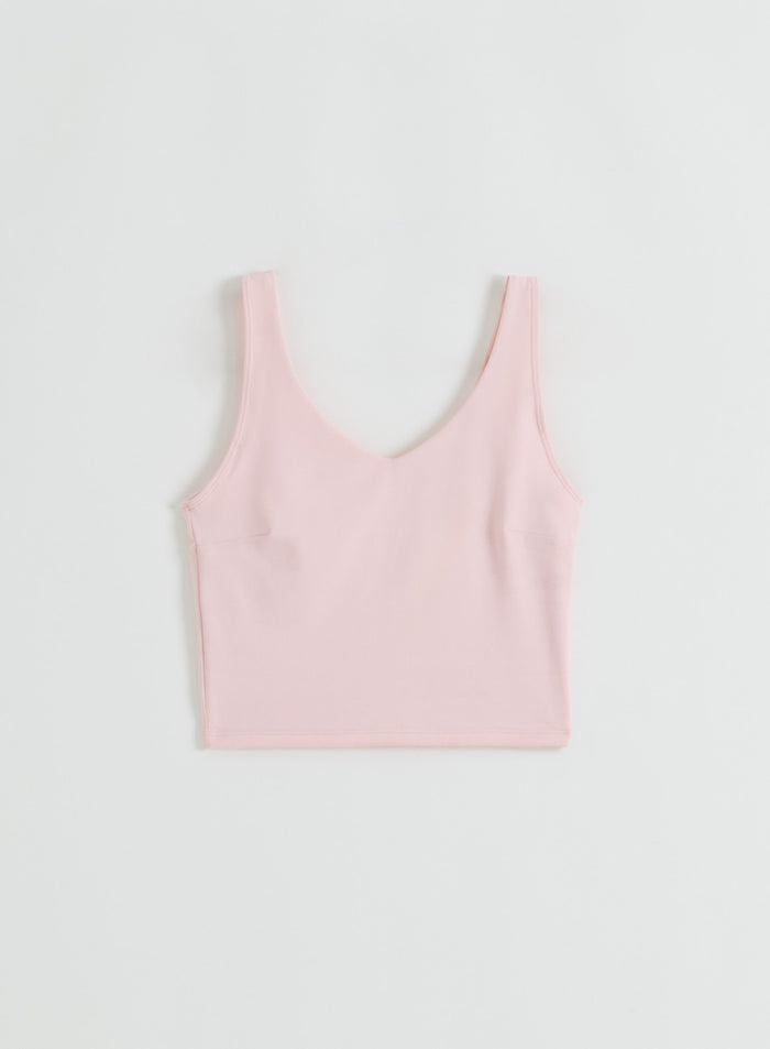 A flatlay of the pink Ballerina Sense Bralette by aim'n