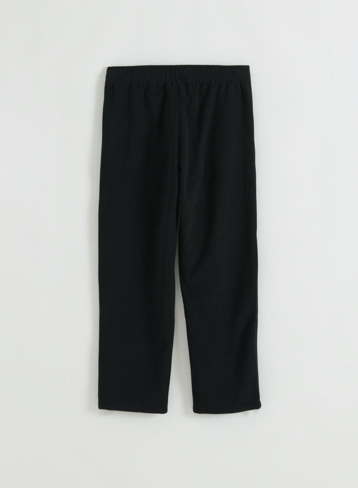 Black fleece pants laid flat