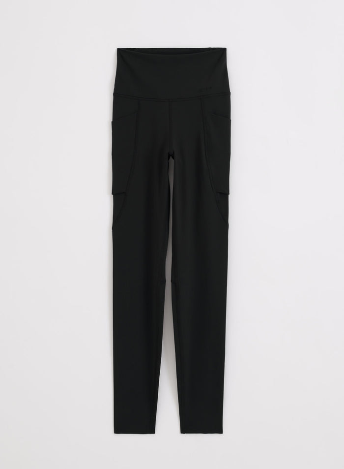 Black buttery-soft Sense Pocket Tights by aim'n with a high waist and side pockets in a flatlay.