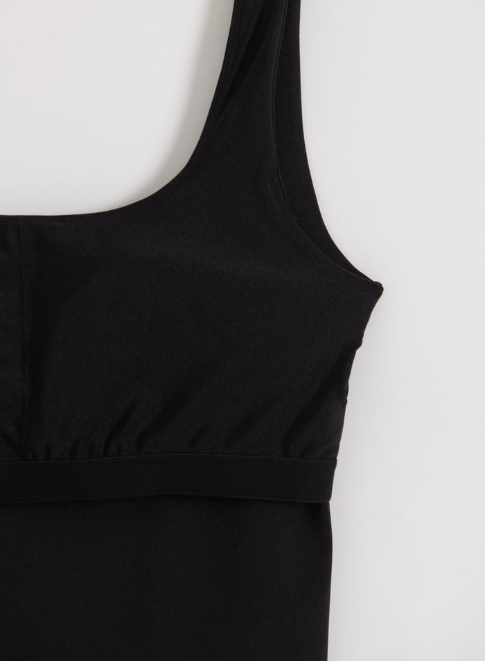 Shimmery black singlet from aim'n featuring a scoop neck and comfortable elastic band.