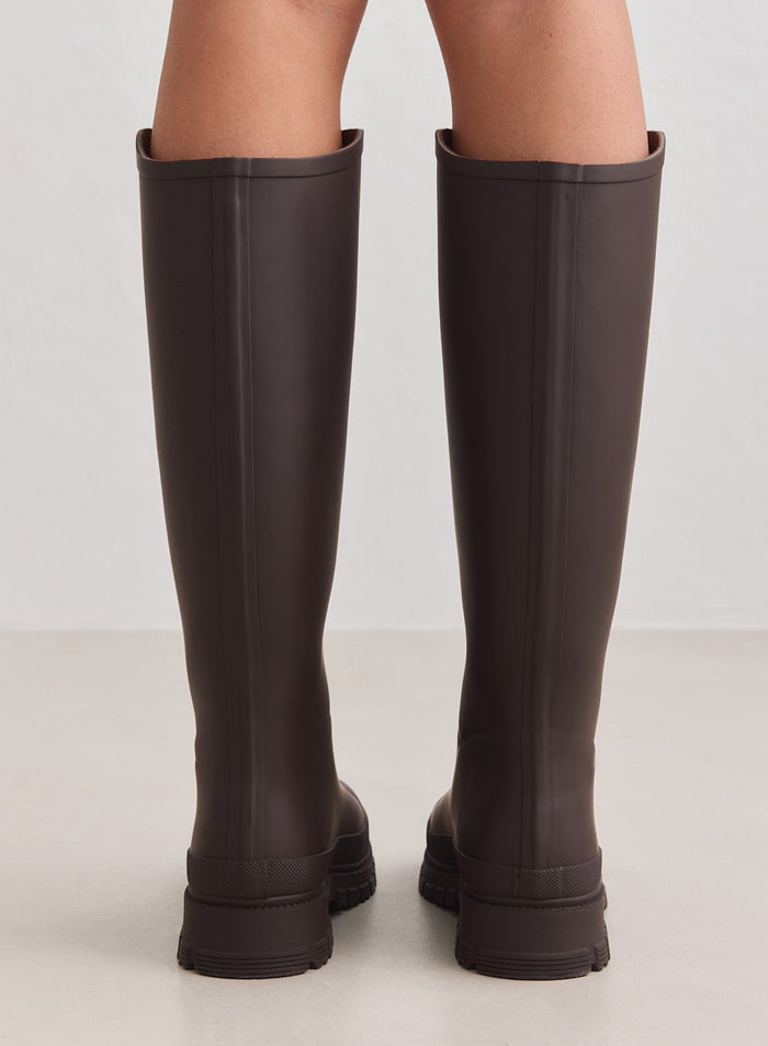 Knee-high matte chocolate rain boots from aim'n featuring a clean silhouette and durable textured outsoles.