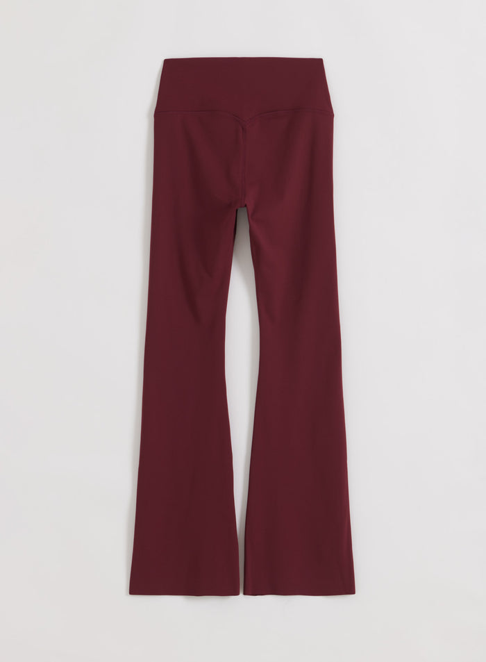 High-waisted Merlot Sense Flare Tights by aim'n with a second skin feel, flared leg, and squat proof design.