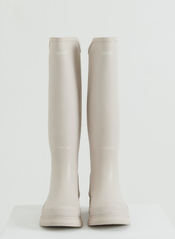 A pair of tall Sand Rain Boots from aim'n.