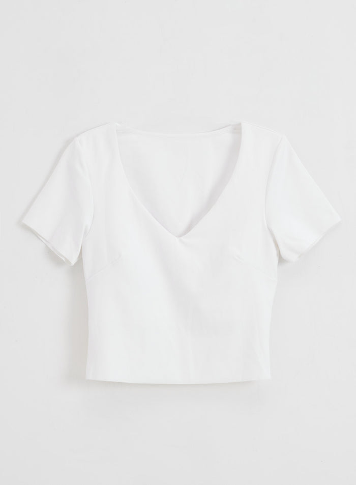 White Sense Short Sleeve Bralette with a v-neck and buttery-soft second skin feel in a flat lay.