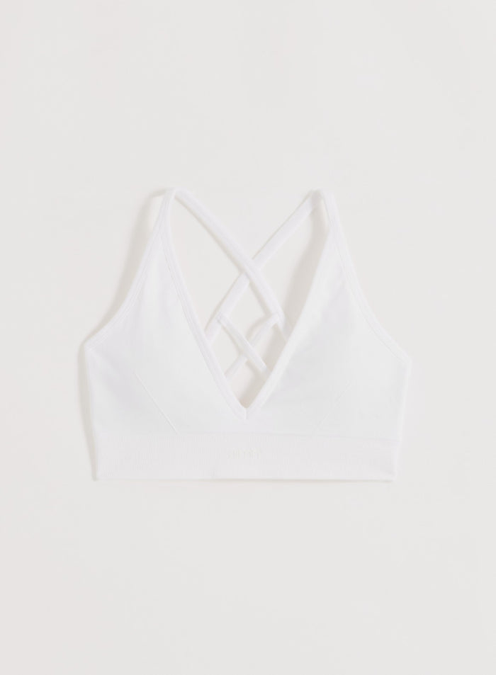White aim'n Shape Seamless Cross Back Bra with cross-back straps and a ribbed underband.