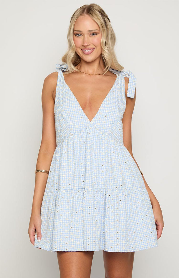 Front view of a blue gingham floral mini dress with a deep V-neckline and tie-shoulder straps