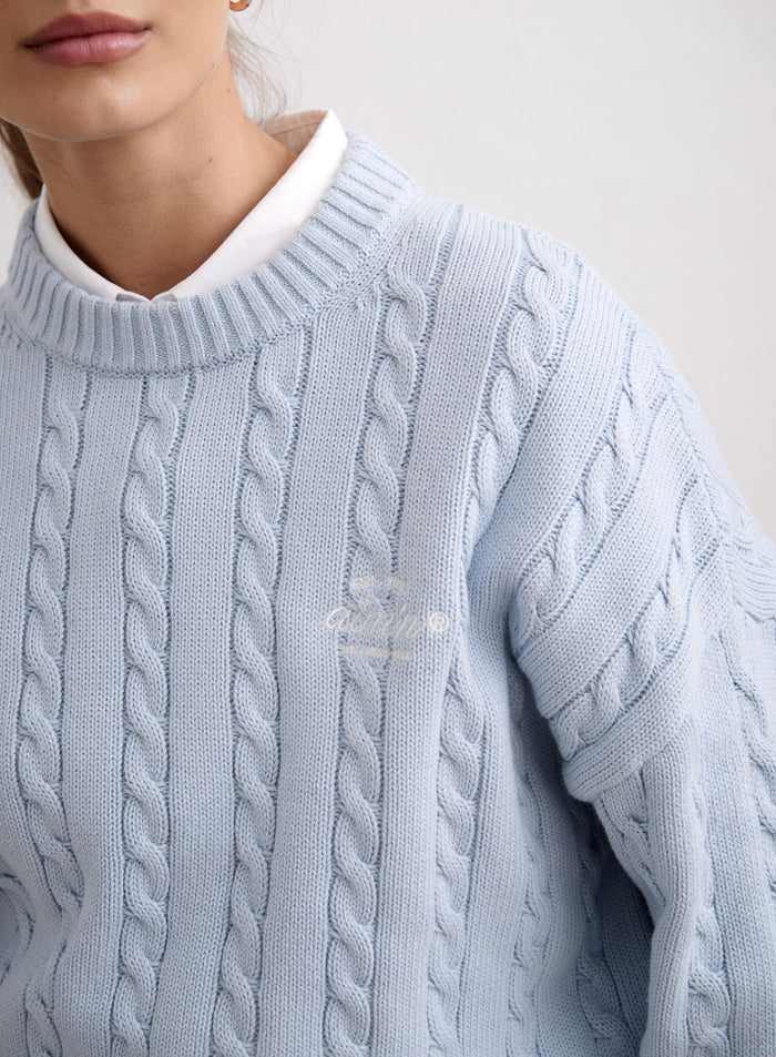 Light blue aim'n Aura Club Cable Knit Sweater in cotton styled over a white collared shirt. [M-174cm]