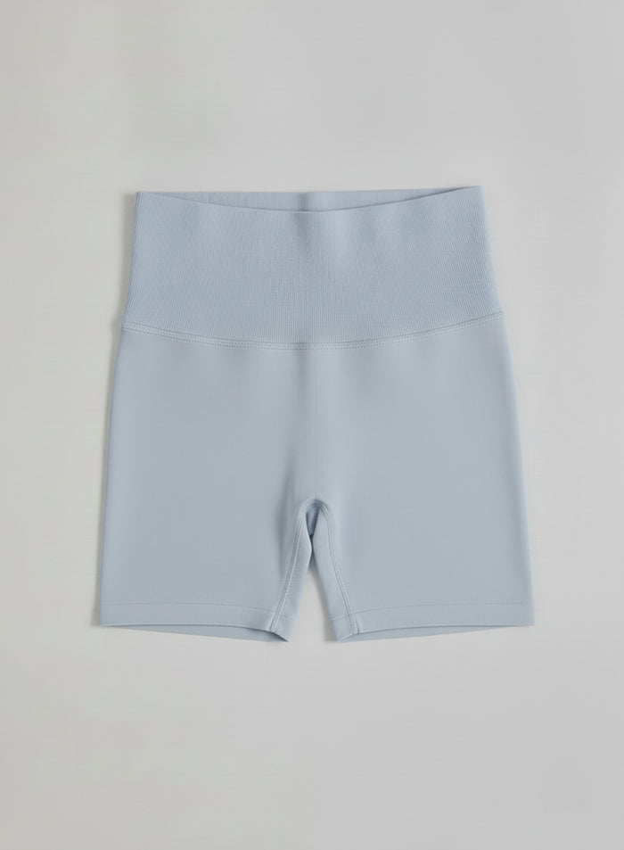 Light blue aim'n Aura Shape Seamless Hotpants featuring a high ribbed waistband in a flatlay.