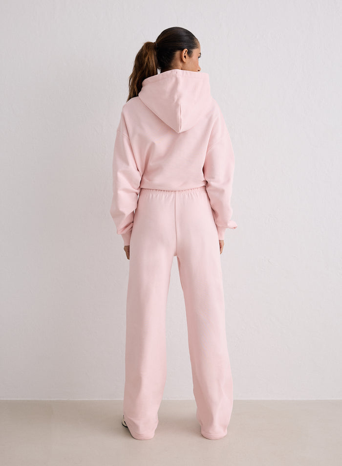 A woman seen from behind wearing pink Ballerina Chunky Terry Sweatpants and a matching hoodie from aim'n [S-170cm]