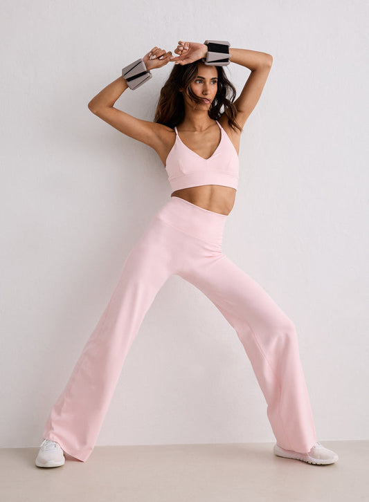 A woman posing in Ballerina Sense Straight Leg Petite Tights and a matching sports bra from aim'n [S-170cm]