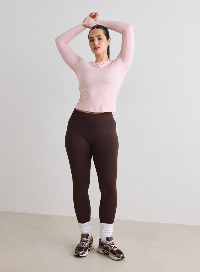 A model wearing a Ballerina Soft Basic Long Sleeve and brown leggings by aim'n [L-170cm]