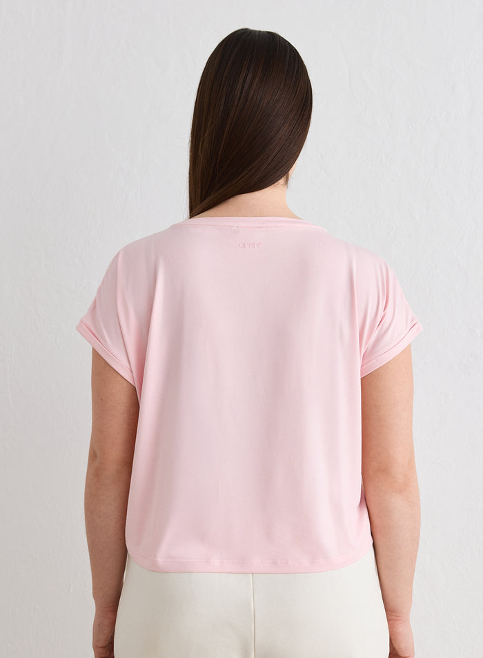 Back view of a woman wearing a pink Ballerina Soft Basic Roll Sleeve Top by aim'n [L-174cm]