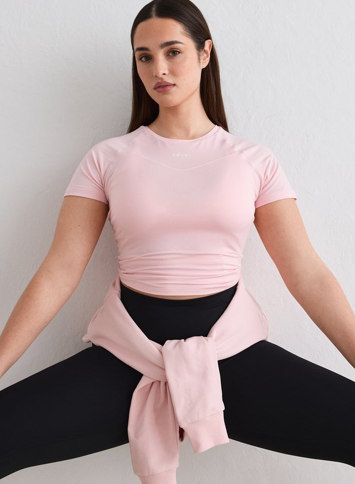 A model posing in a pink Ballerina Soft Basic Short Sleeve by aim'n [L-174cm]