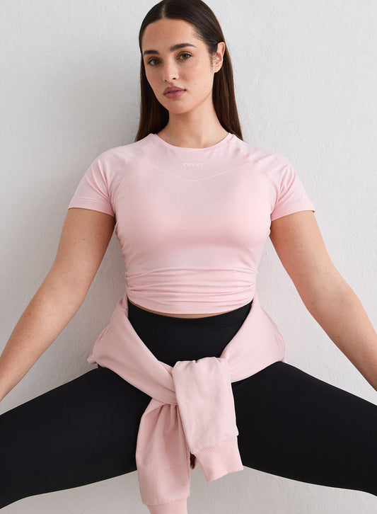 A model posing in a pink Ballerina Soft Basic Short Sleeve by aim'n [L-174cm]