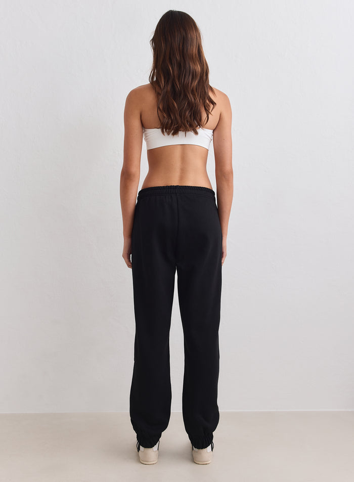 Black aim'n Classic Sweatpants in soft brushed jersey with cuffed ankles, shown from behind [S-163cm]