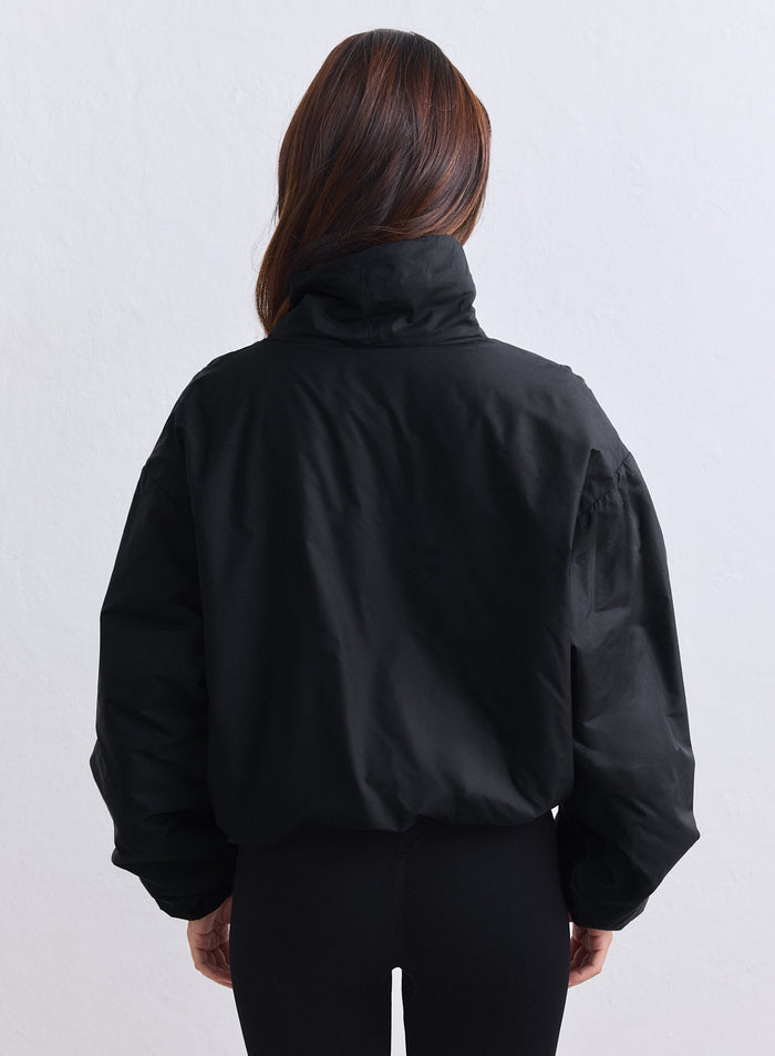 Black aim'n Cloud Jacket with an oversized woven silhouette and high collar, back view. [S-163cm]