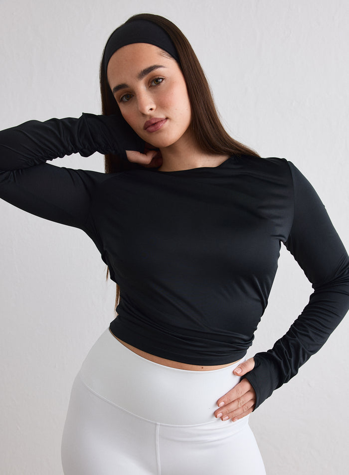 Model wearing the Black Luminous Draped Long Sleeve and a matching black headband [L-174cm]