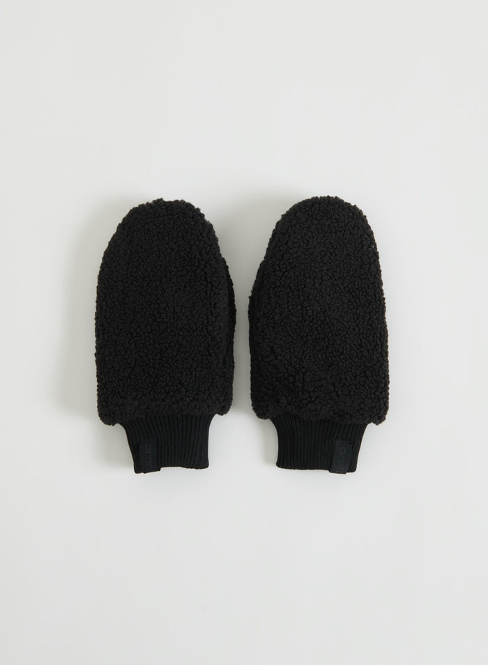 Pair of black pile mittens with ribbed cuffs displayed in a flat lay