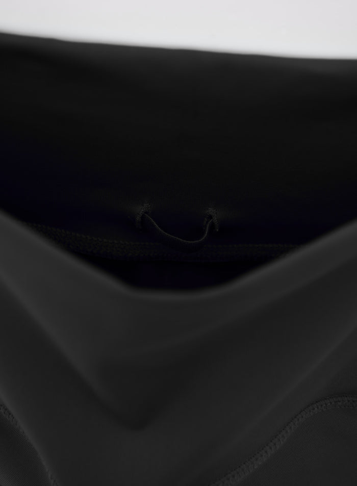 Functional inner waistband loop detail on these sleek black moisture-wicking aim'n Running Biker Shorts.