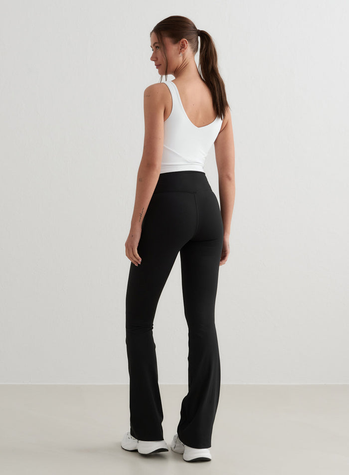 Black Sense Flare Tights by aim'n with a high waist, flared leg, and squat proof second skin fabric.