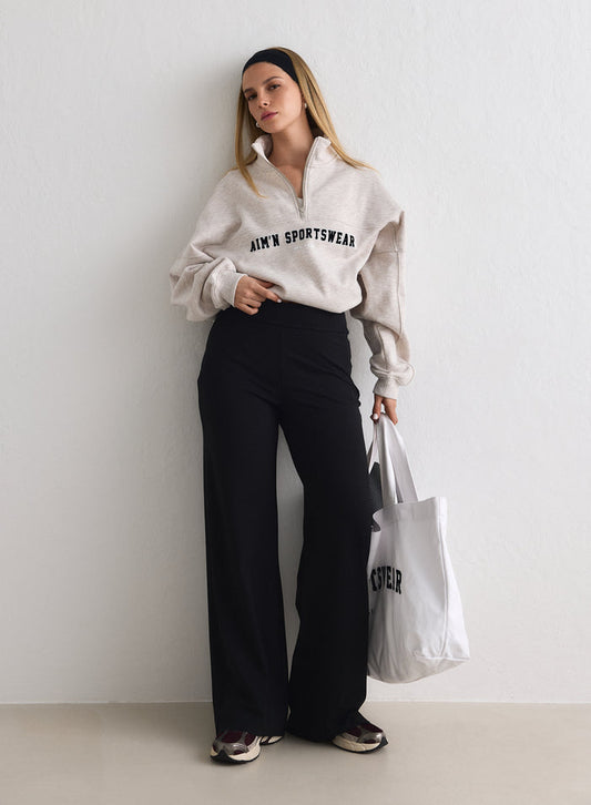 Black high-waisted Sense Tall Pants with a wide-leg fit, paired with a beige sweatshirt by aim'n. [M-170cm]
