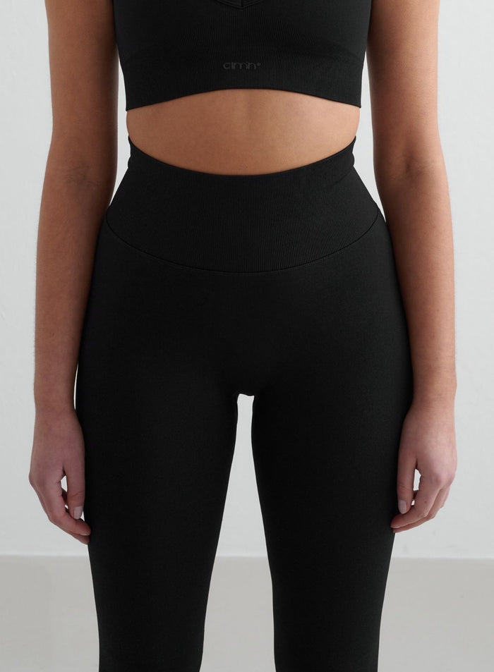 Black aim'n Shape Seamless Tall Tights featuring a high ribbed waist for second skin comfort.