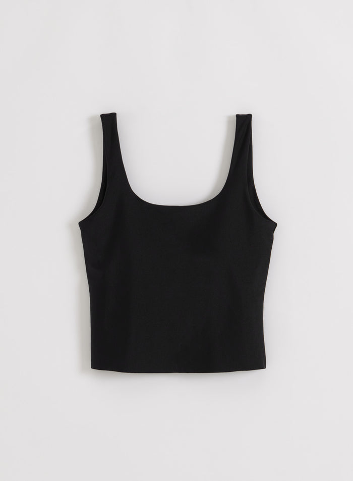 Black shimmer singlet from aim'n with wide straps and a scoop neck in a flat lay.