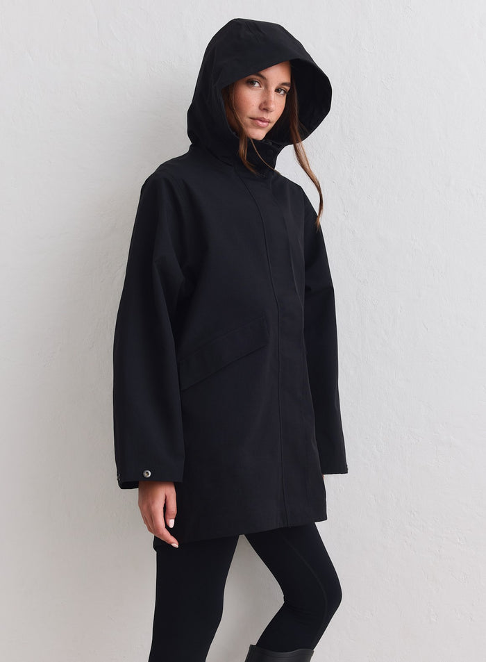 Black aim'n Waterproof Hood Jacket featuring a minimalist style and protective hood. [M-178cm]