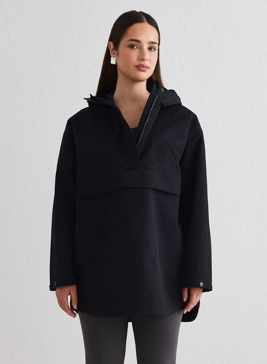 Woman wearing a Black Waterproof Oversized Anorak from aim'n [M-174cm]