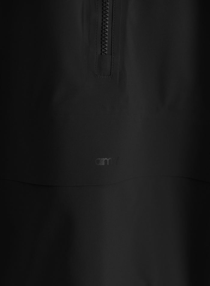 Close-up of a black waterproof stretch anorak with a front zipper and subtle aim'n logo