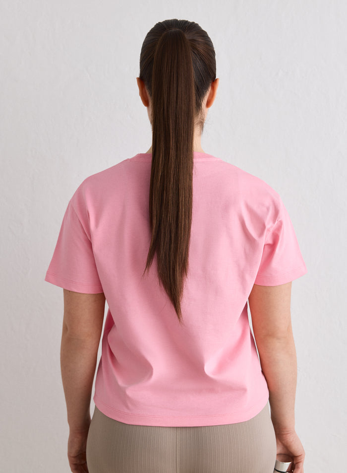 Back view of a person wearing a Blush Boxy T-shirt by aim'n [L-174cm]