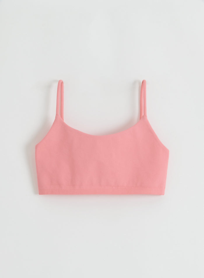 A flatlay of the Blush Shape Seamless Strap Bra from aim'n