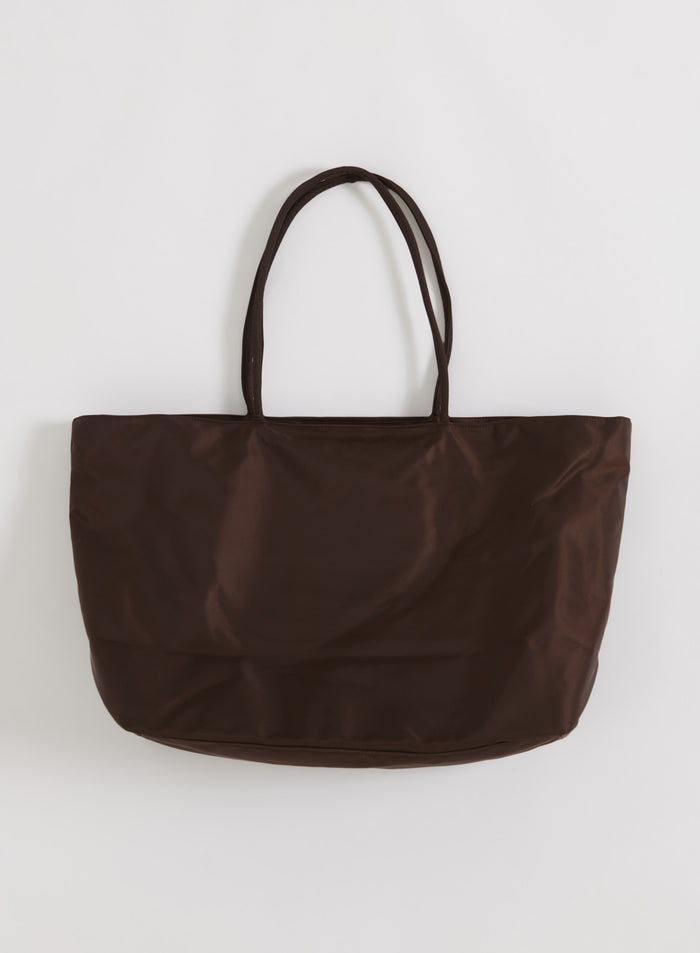 Chocolate nylon weekend bag by aim'n featuring a smooth finish and durable straps in a flatlay view.