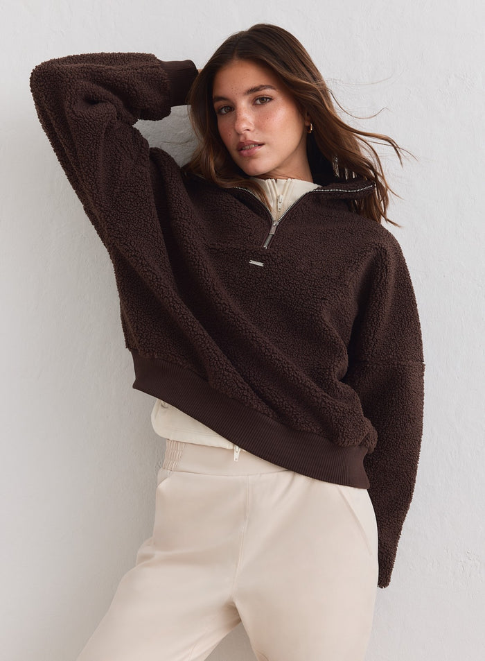 Woman in a chocolate brown Pile Half Zip by aim'n featuring cozy textured fleece. [xs-178cm]