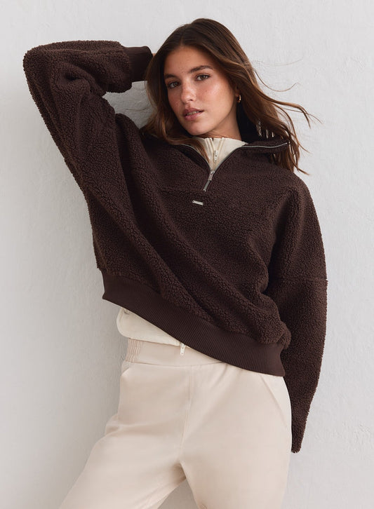 Woman in a chocolate brown Pile Half Zip by aim'n featuring cozy textured fleece. [xs-178cm]