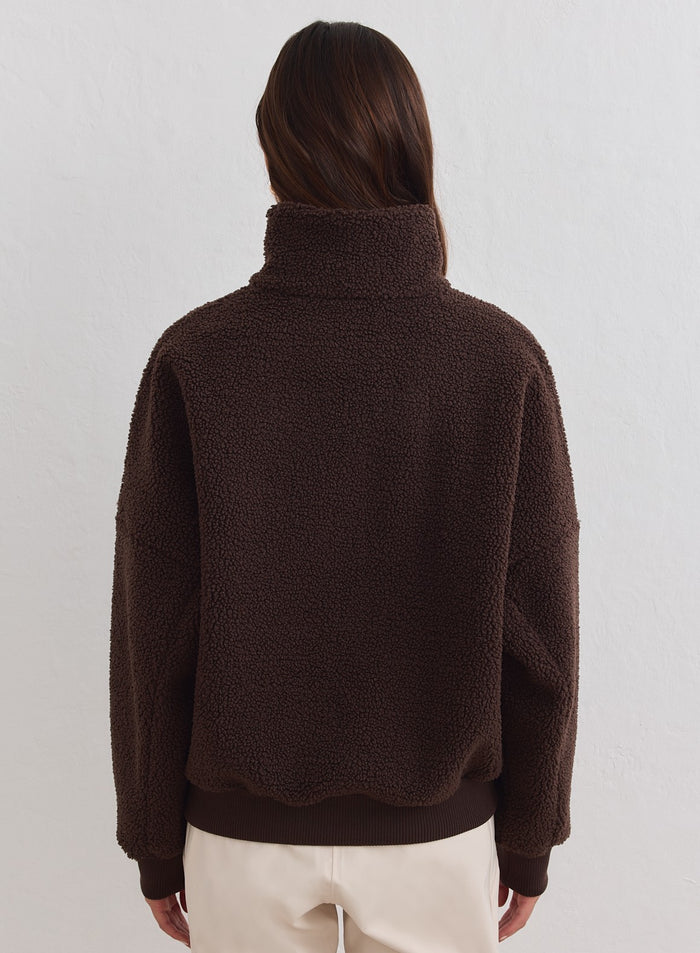 Chocolate brown pile fleece half-zip jacket shown from the back with a cozy high collar. [xs-178cm]