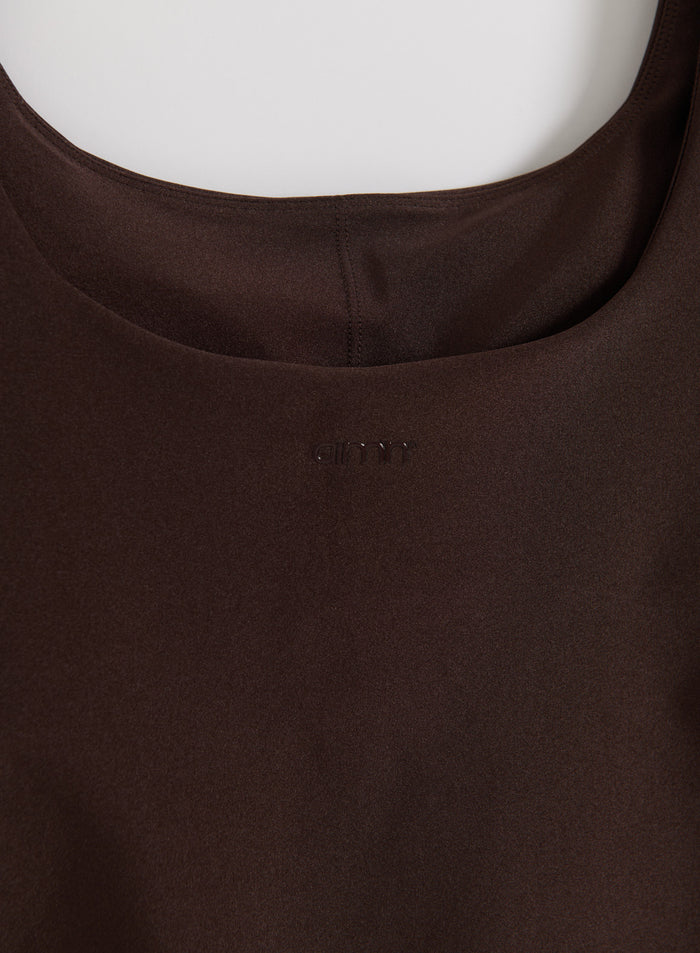 Chocolate Shimmer Singlet detail showing the neckline and tonal aim'n logo on shimmery brown fabric.