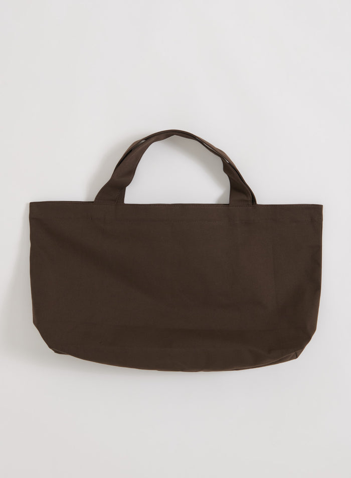 Chocolate brown cotton Varsity Tote Bag by aim'n shown in a flatlay view.