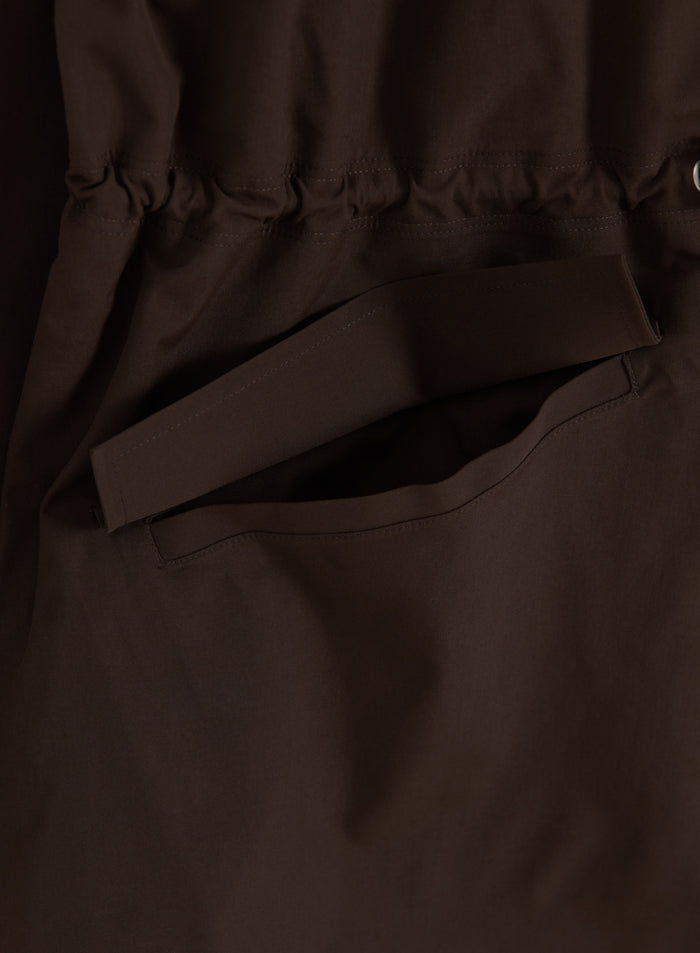 Chocolate brown aim'n Waterproof Zip Jacket detail showing a pocket with lid and adjustable waist.