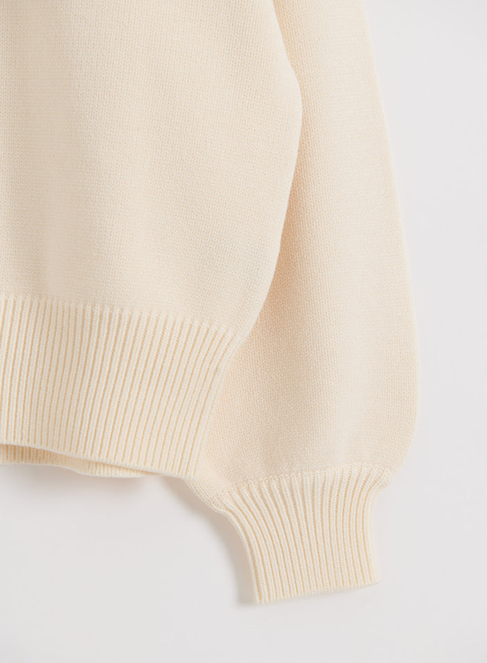 Cream aim'n Athletic Knit Sweatshirt featuring a soft knit texture and ribbed detailing on the cuff and hem.
