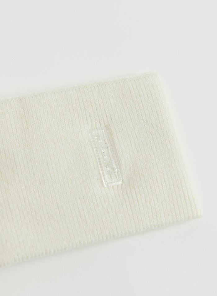 Cream ribbed knit headband with logo detail, shown flat lay