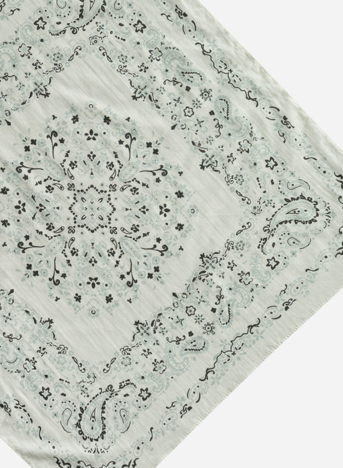 Cream outdoor scarf with a detailed paisley and floral print pattern, shown in a flatlay view
