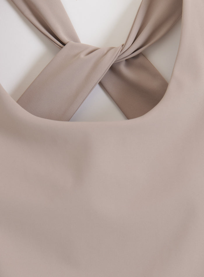Strappy back with twisted bands on the Dark Clay Lunar Running Singlet by aim'n.