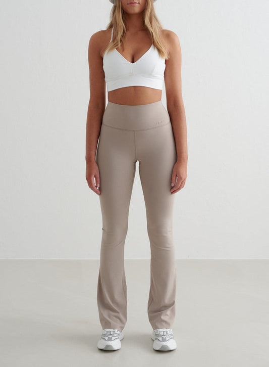 Dark Clay aim'n Sense Flare Tights with a high waist, flared leg, and squat proof second skin feel.