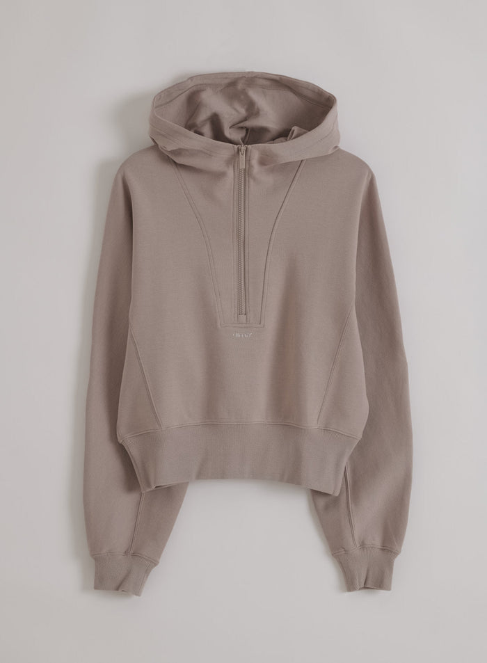 Dark clay Sportif Half Zip Hood by aim'n in structured jersey with a half-zip front and fixed hood, shown as a flatlay.