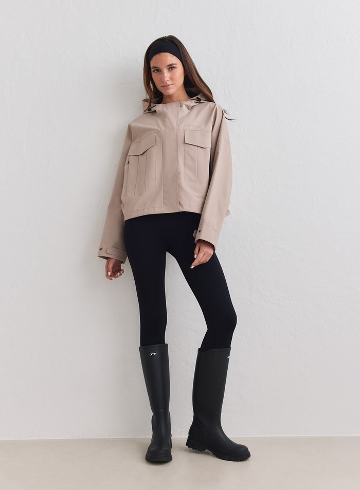 Dark clay aim'n Waterproof Jacket featuring a cropped fit and cargo pockets [M-178cm]