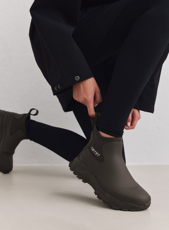 Dark Ivy Fusion Rain Boot with a chunky sneaker outsole and rubber upper, featuring the aim'n logo.