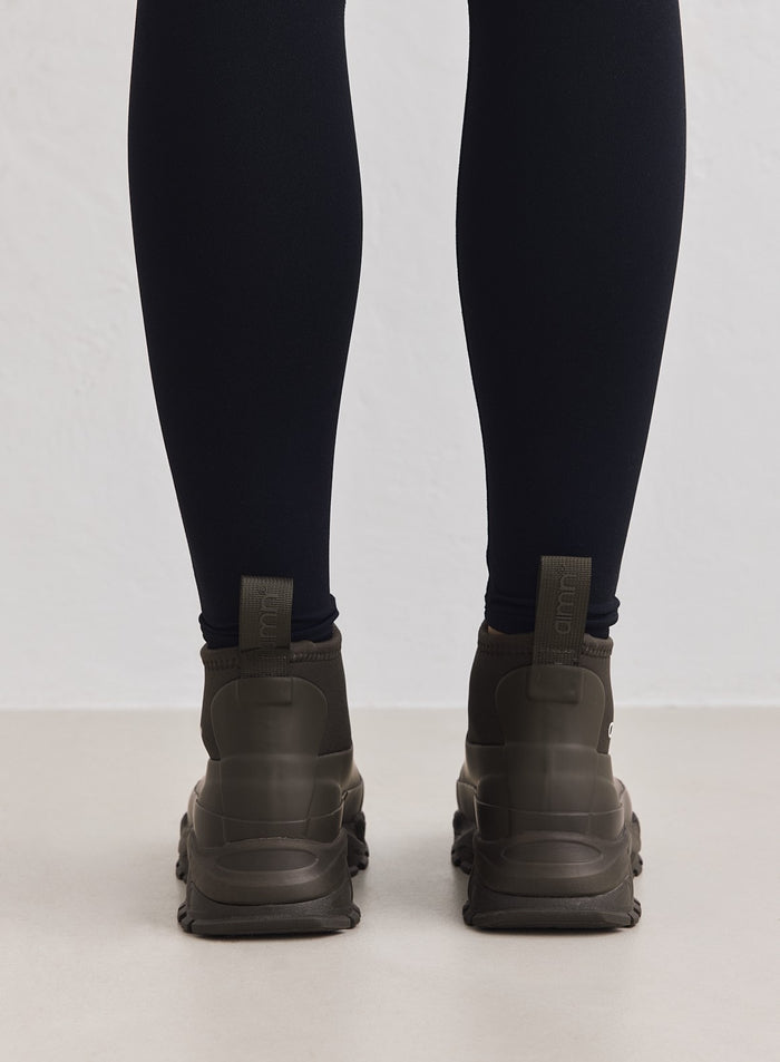 Dark Ivy Fusion Rain Boots shown from behind with chunky sneaker outsoles and pull tabs by aim'n.