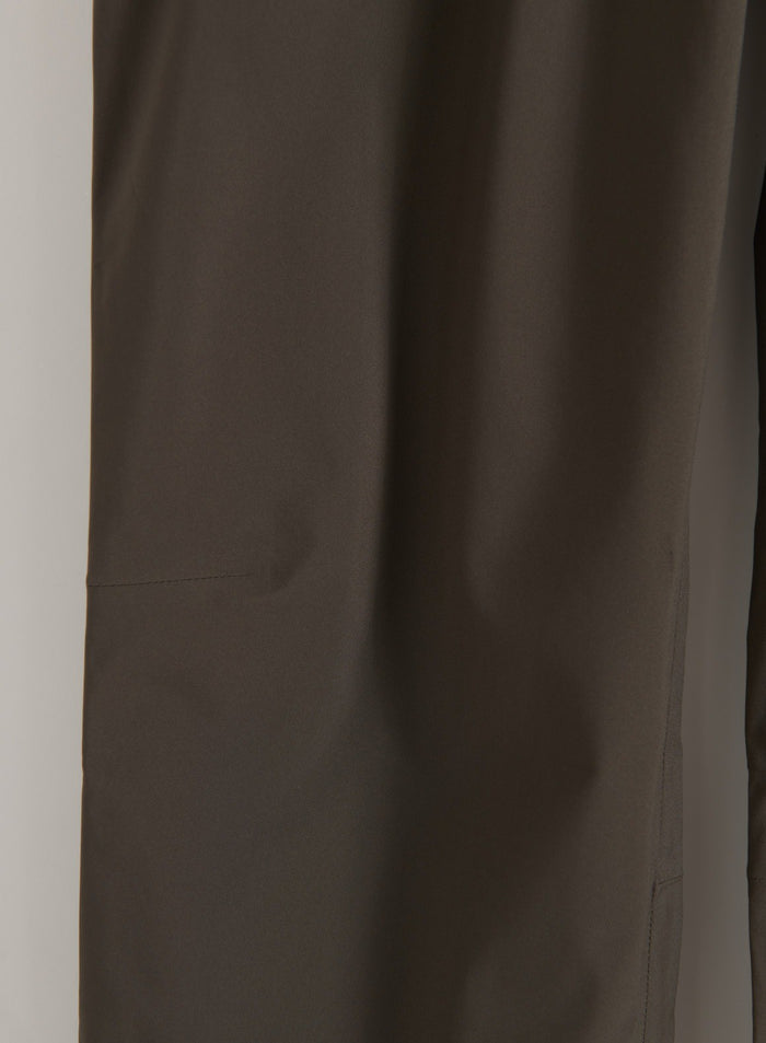 Close-up of Dark Ivy waterproof pants fabric and stitching