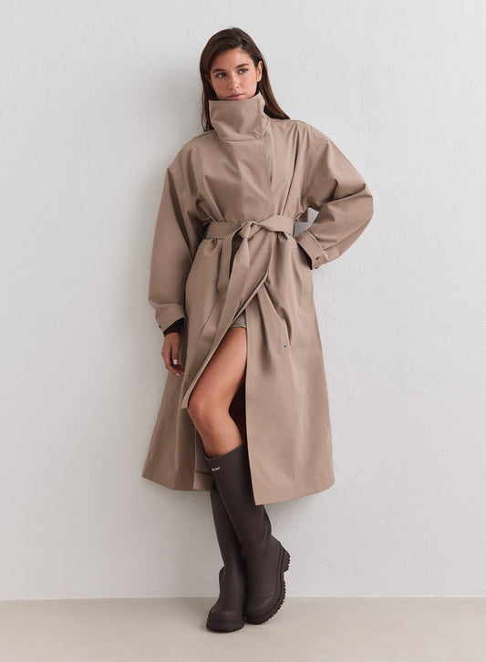 Espresso Waterproof Coat by aim'n with a high collar and belted waist, styled with boots. [M-178cm]